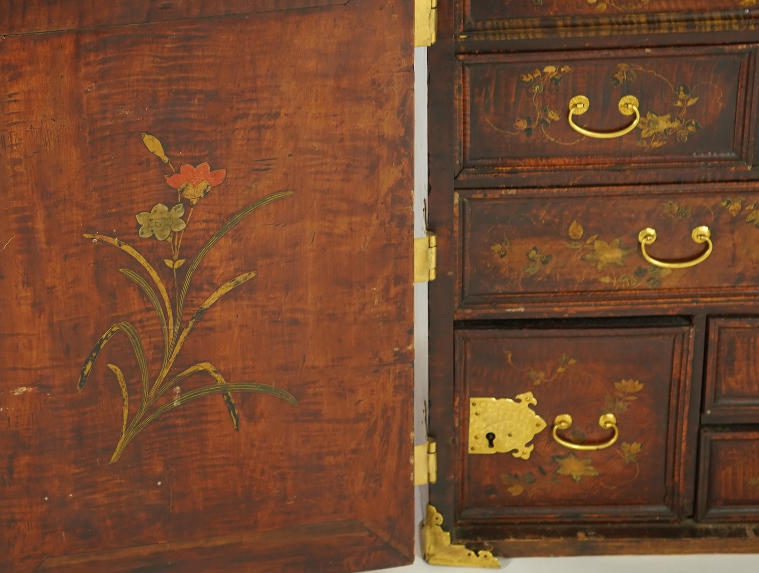 A Japanese mulberry wood, hiromaki-e lacquer and gilt copper mounted cabinet, c.1680-1700